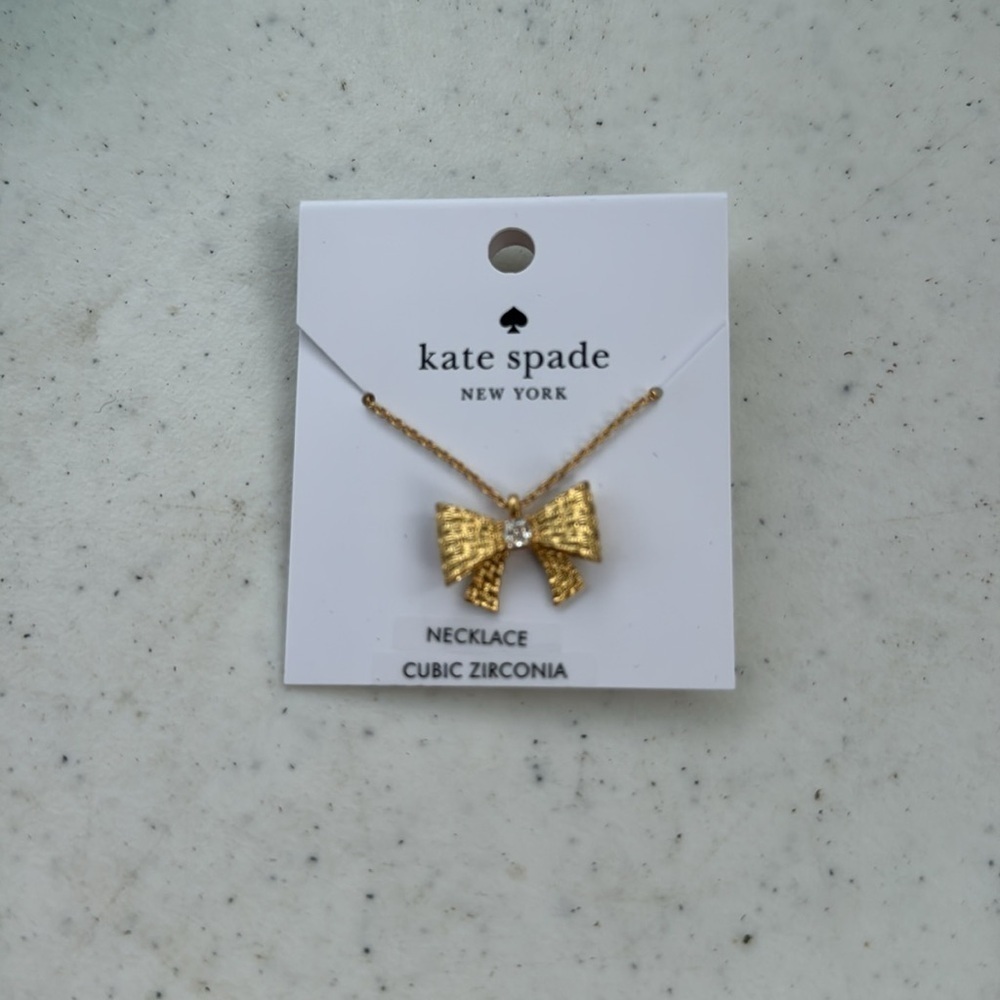 Kate Spade gold Wrapped in a Bow cubic zirconia necklace. NWT.